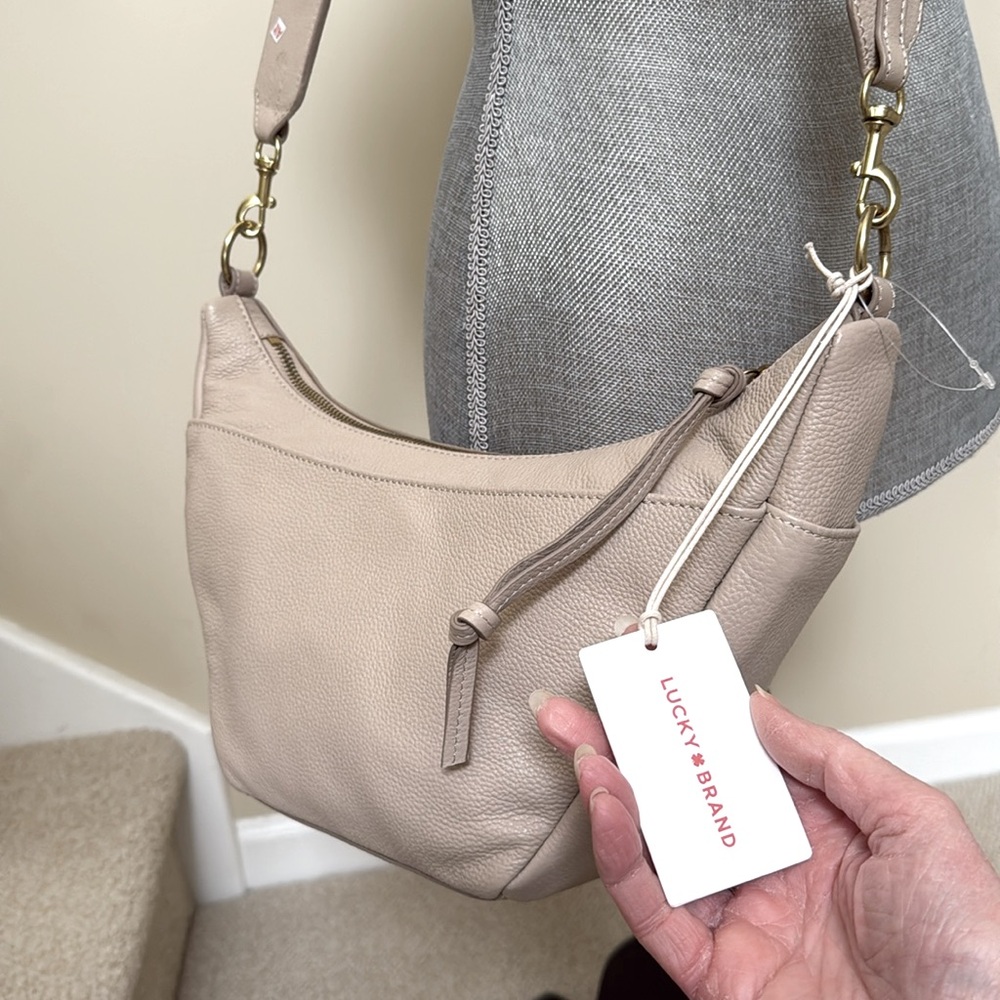 - New Lucky Brand Tan crossbody bag. Outside has snap pocket  & LUCKY BRAN… - Picture 2 of 16